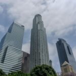 The US Companies Owning the Largest Warehouse Space Visualized with Manhattan Island for Scale Comparison